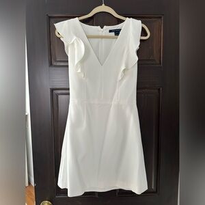 White sleeveless dress perfect for bridal shower or rehearsal dinner